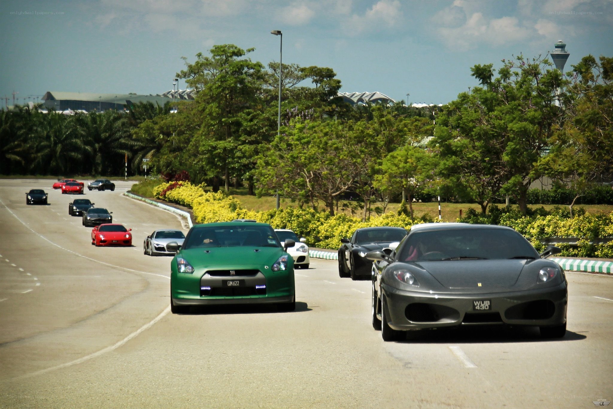 Supercar convoy on a road