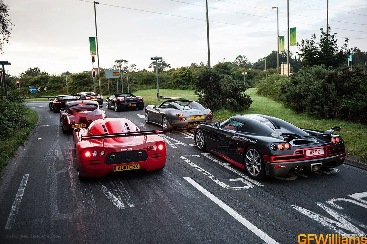 supercar convoy on road