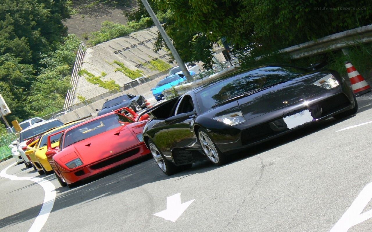 Supercar lineup on a road