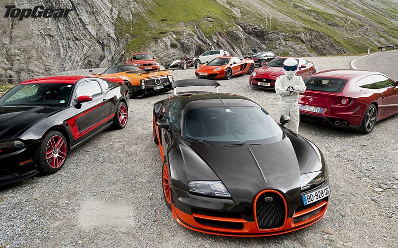 Supercar lineup on mountain road