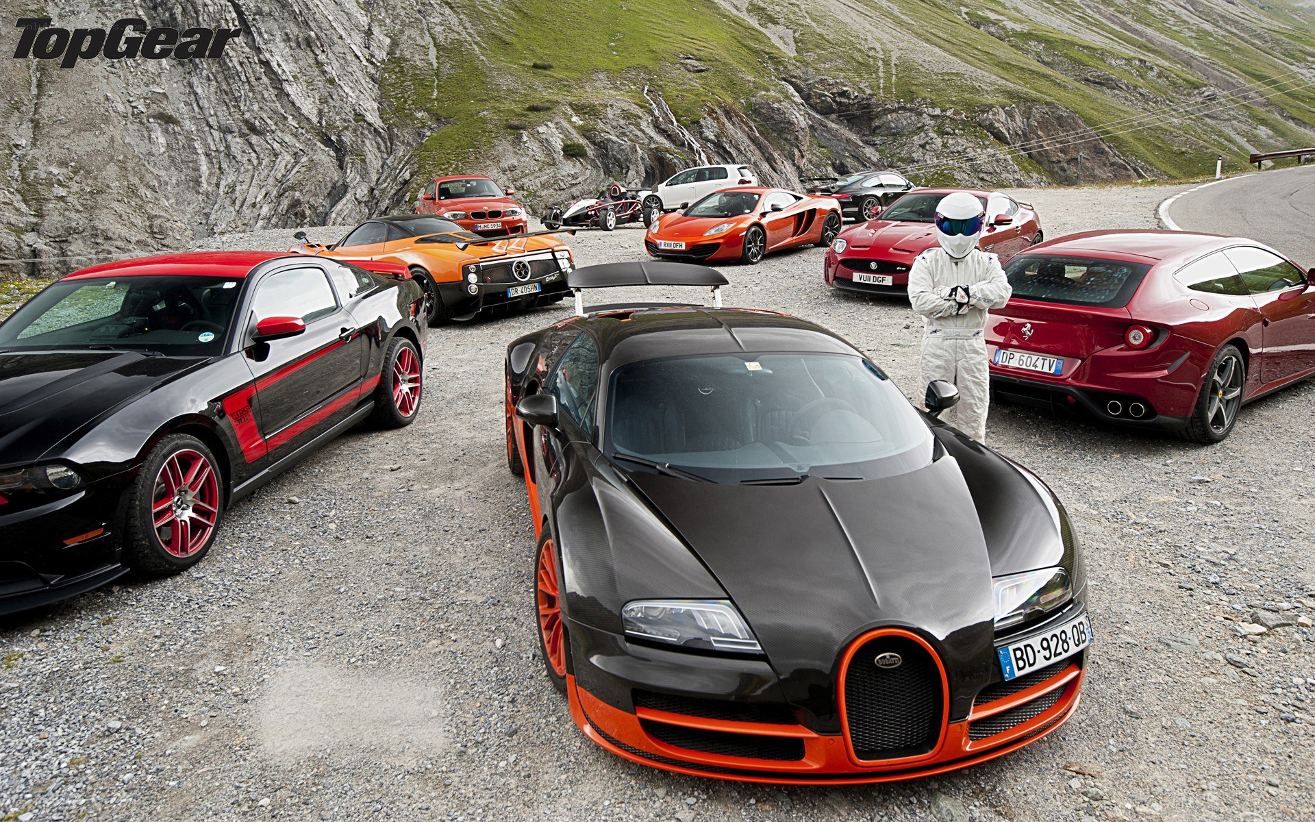Supercar lineup on mountain road