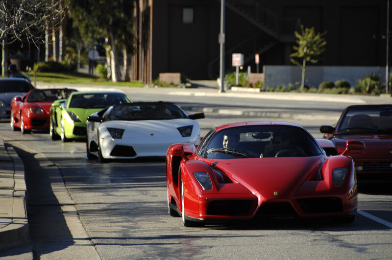 supercar parade on city street