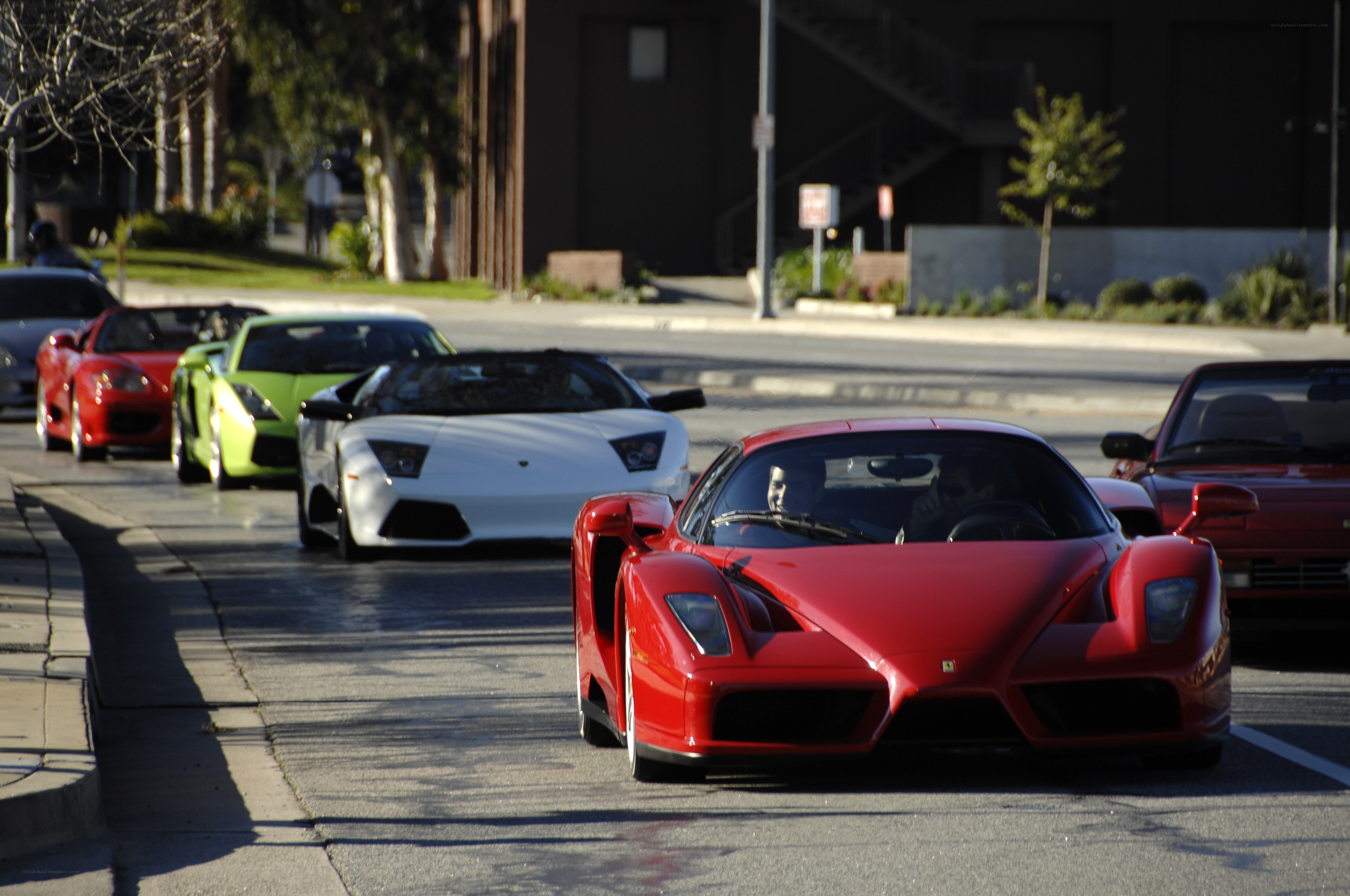 supercar parade on city street