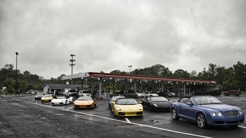 Supercars at a gas station