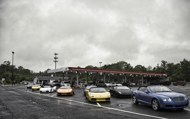 Supercars at a gas station