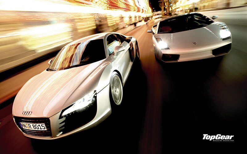 Supercars racing at night