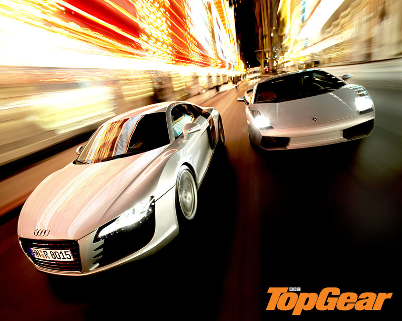 Supercars racing at night