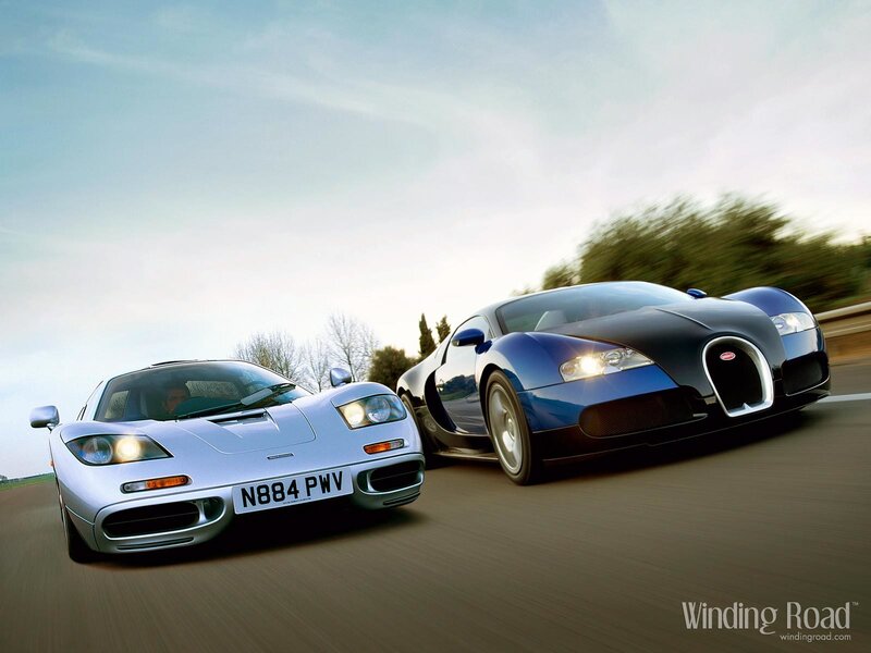 Supercars racing on a road