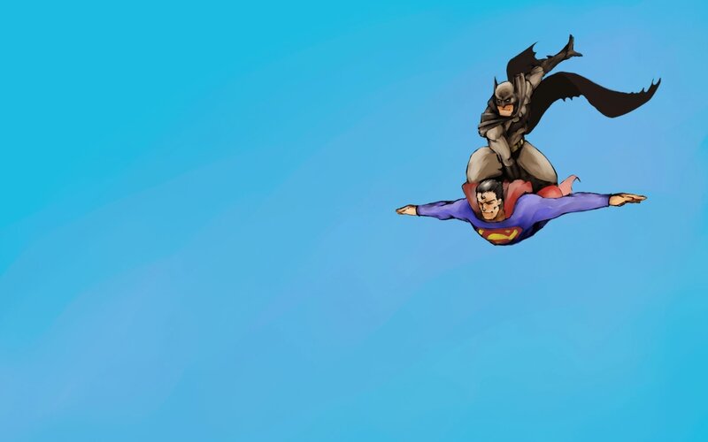 Superman and Batman flying