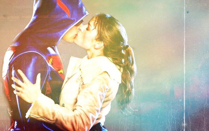 superman and woman kissing