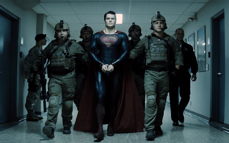 Superman being escorted