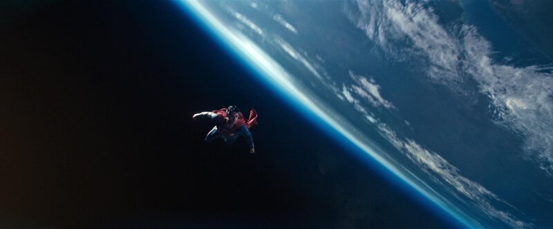 Superman flying above Earth