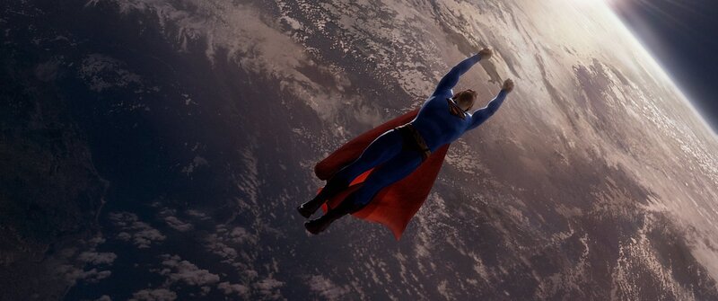 Superman flying above Earth