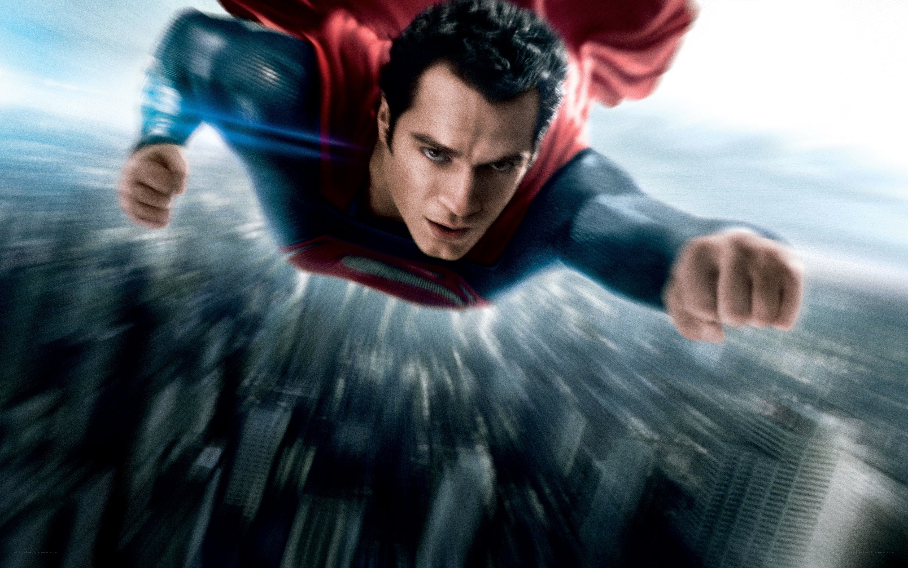 Superman flying over city