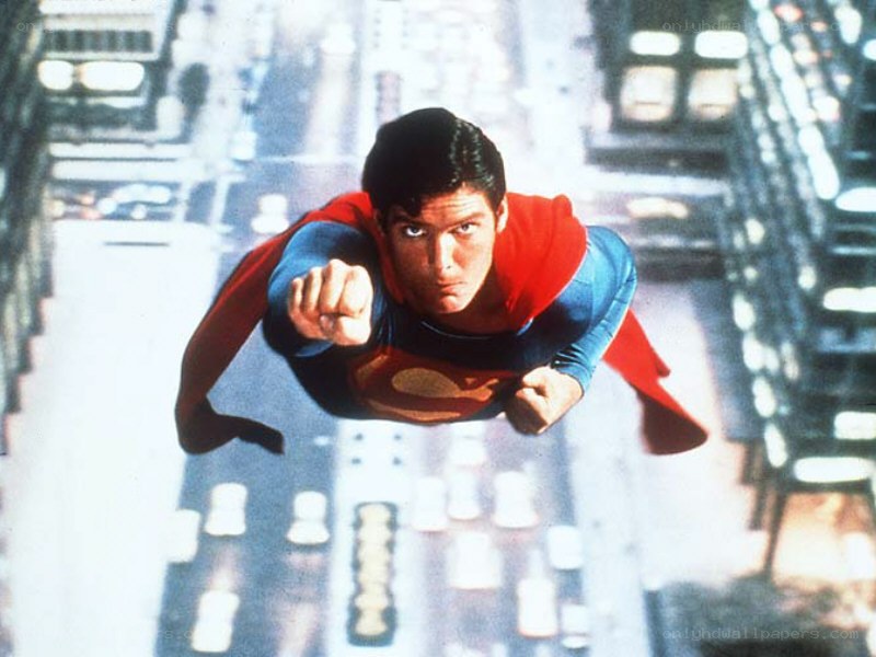 Superman flying over city