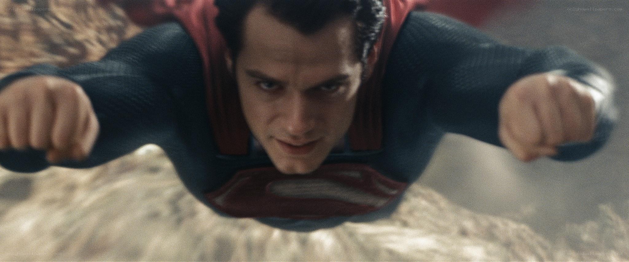 Superman flying over terrain