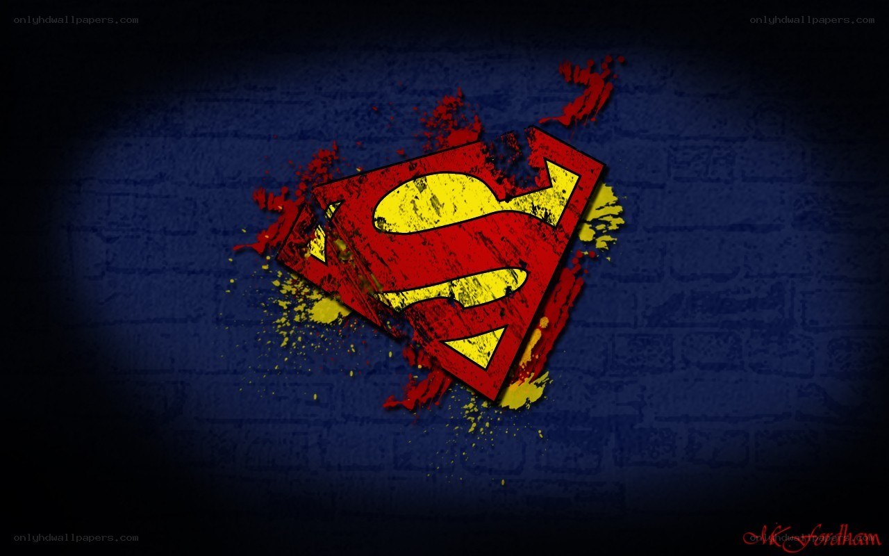 Superman logo on brick wall