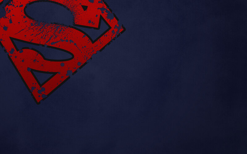 Superman logo on dark background