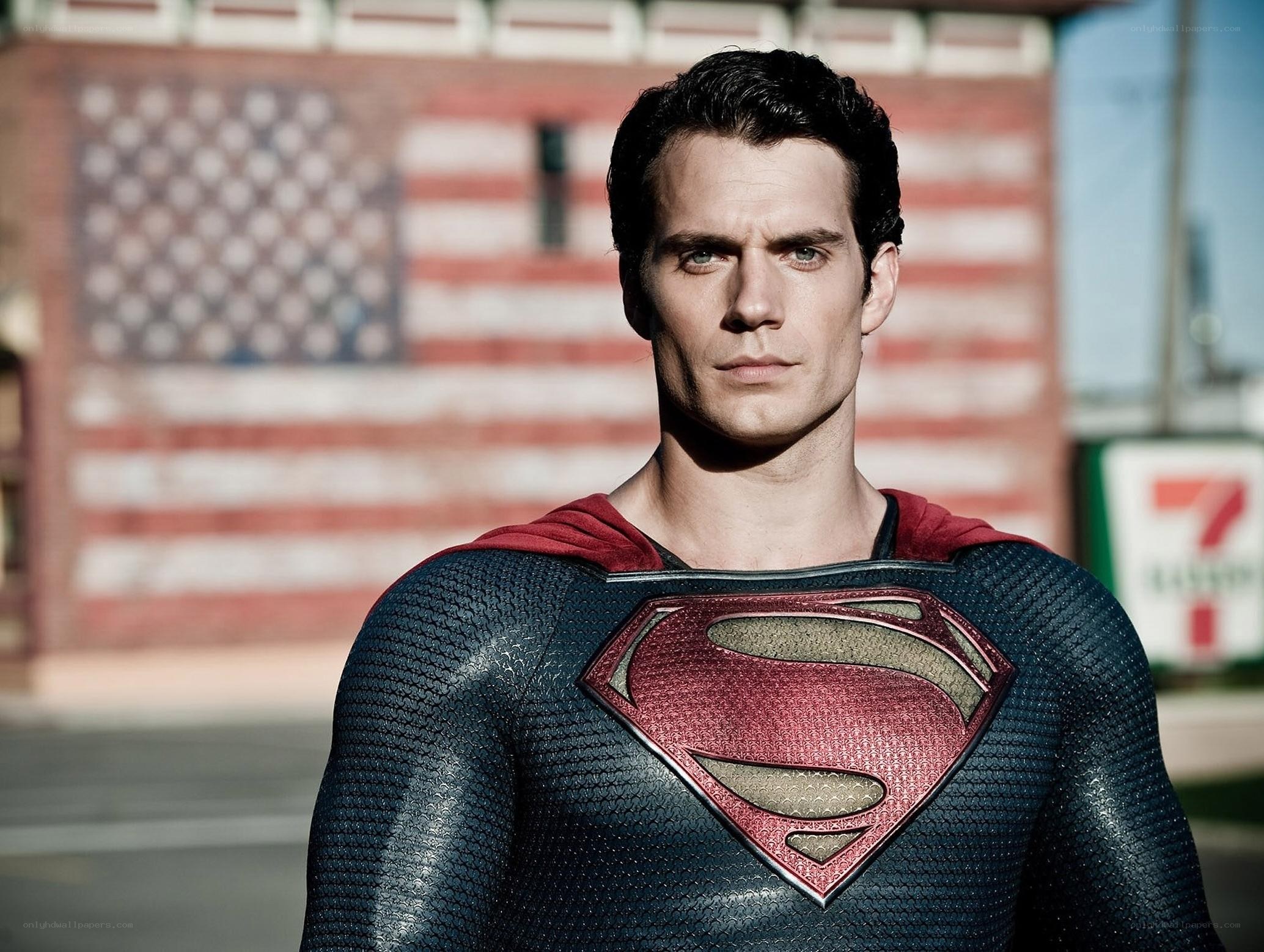 Superman stands before flag
