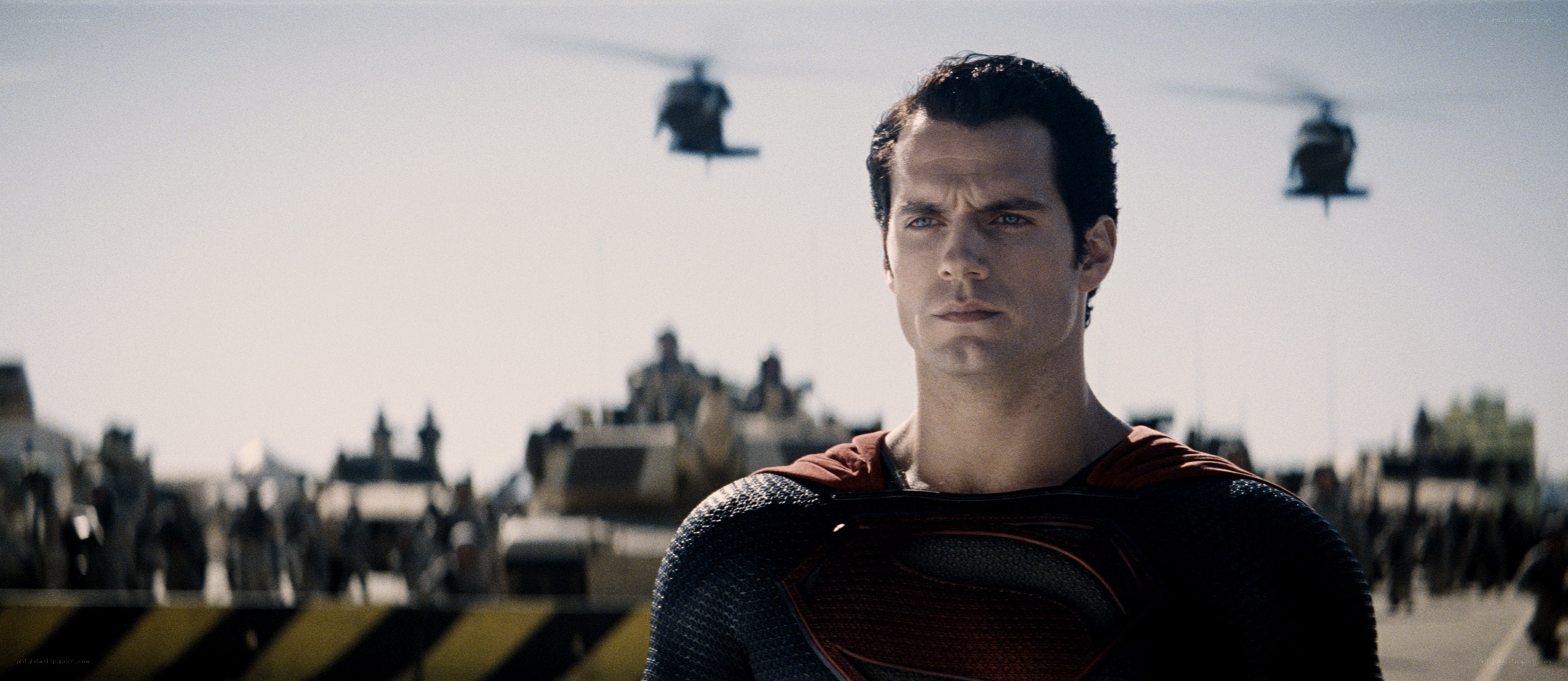 Superman stands before military forces