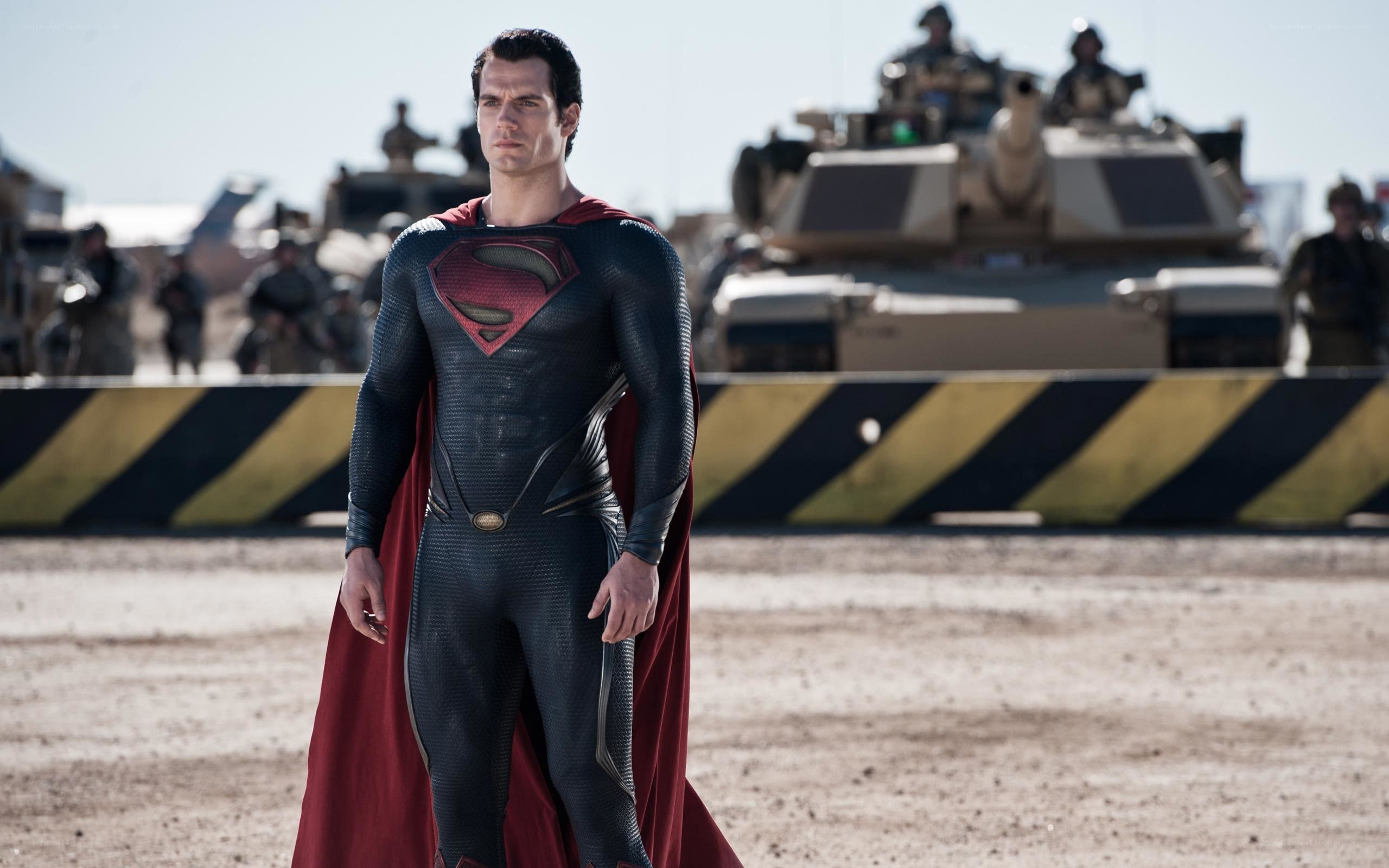 Superman stands in desert