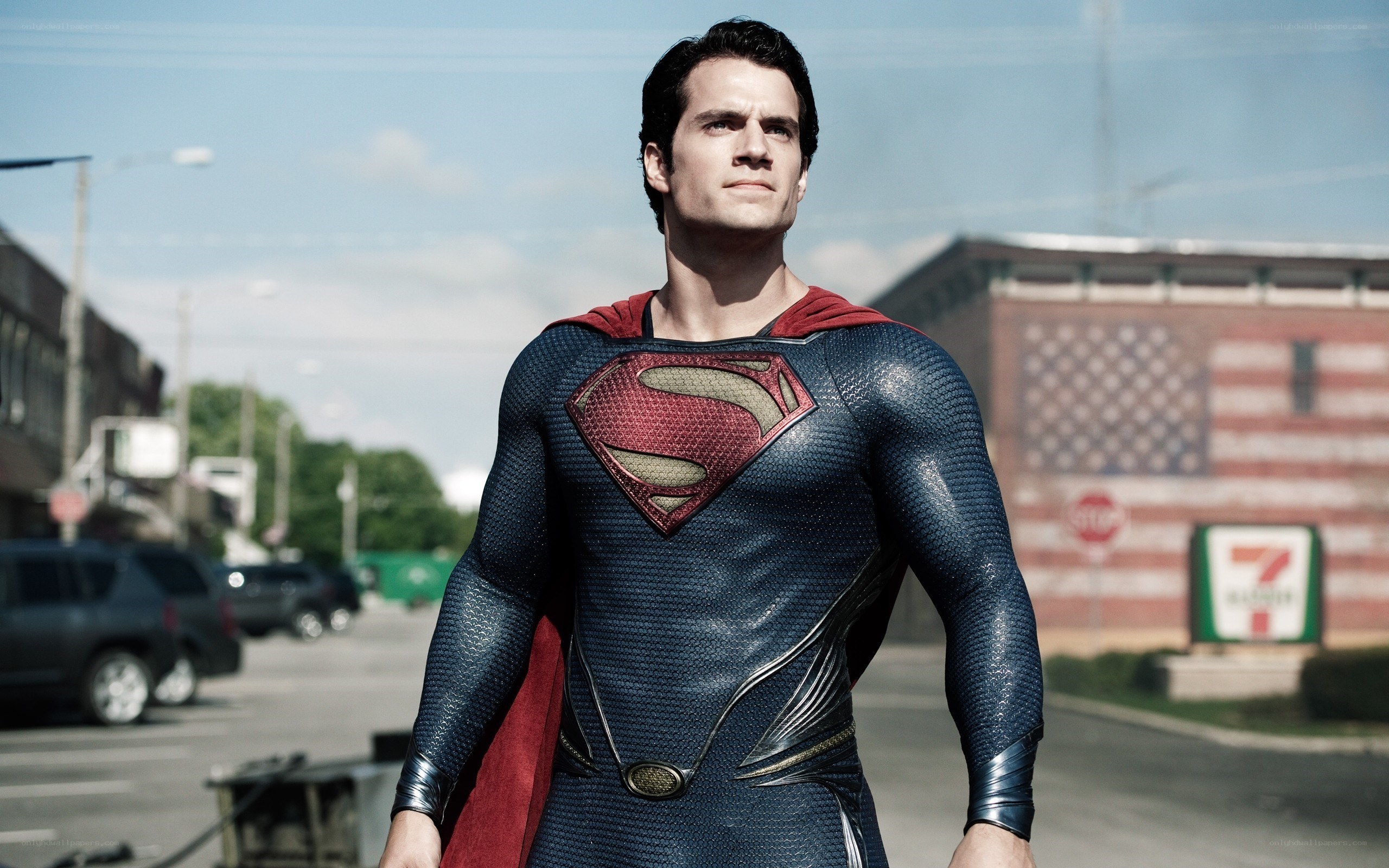 Superman stands on a street