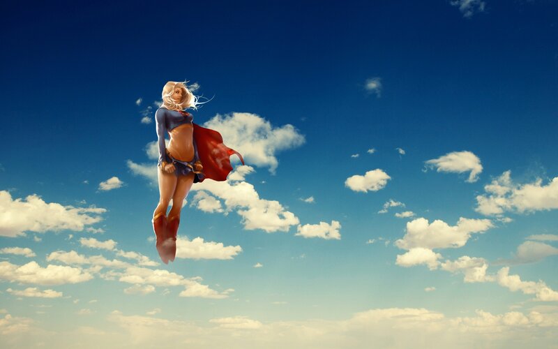 Superwoman flying in the sky