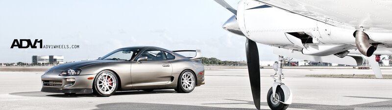 Supra next to a plane