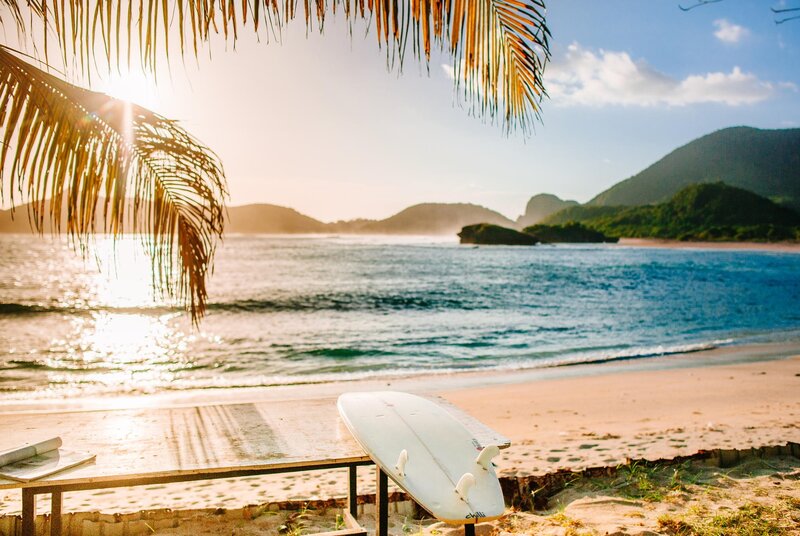Surfboard on Beach — Blue, Serene, Sunset