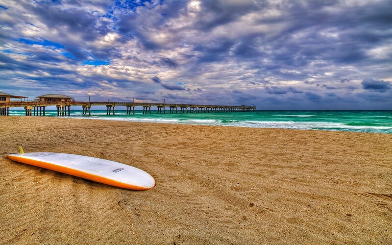 Surfboard on Beach — Brown