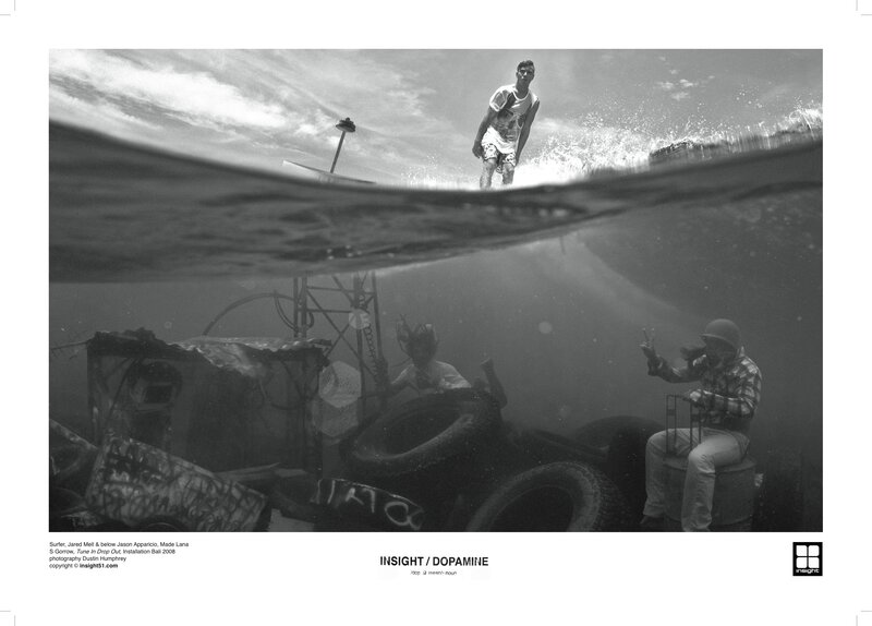 Surfer above water, divers below