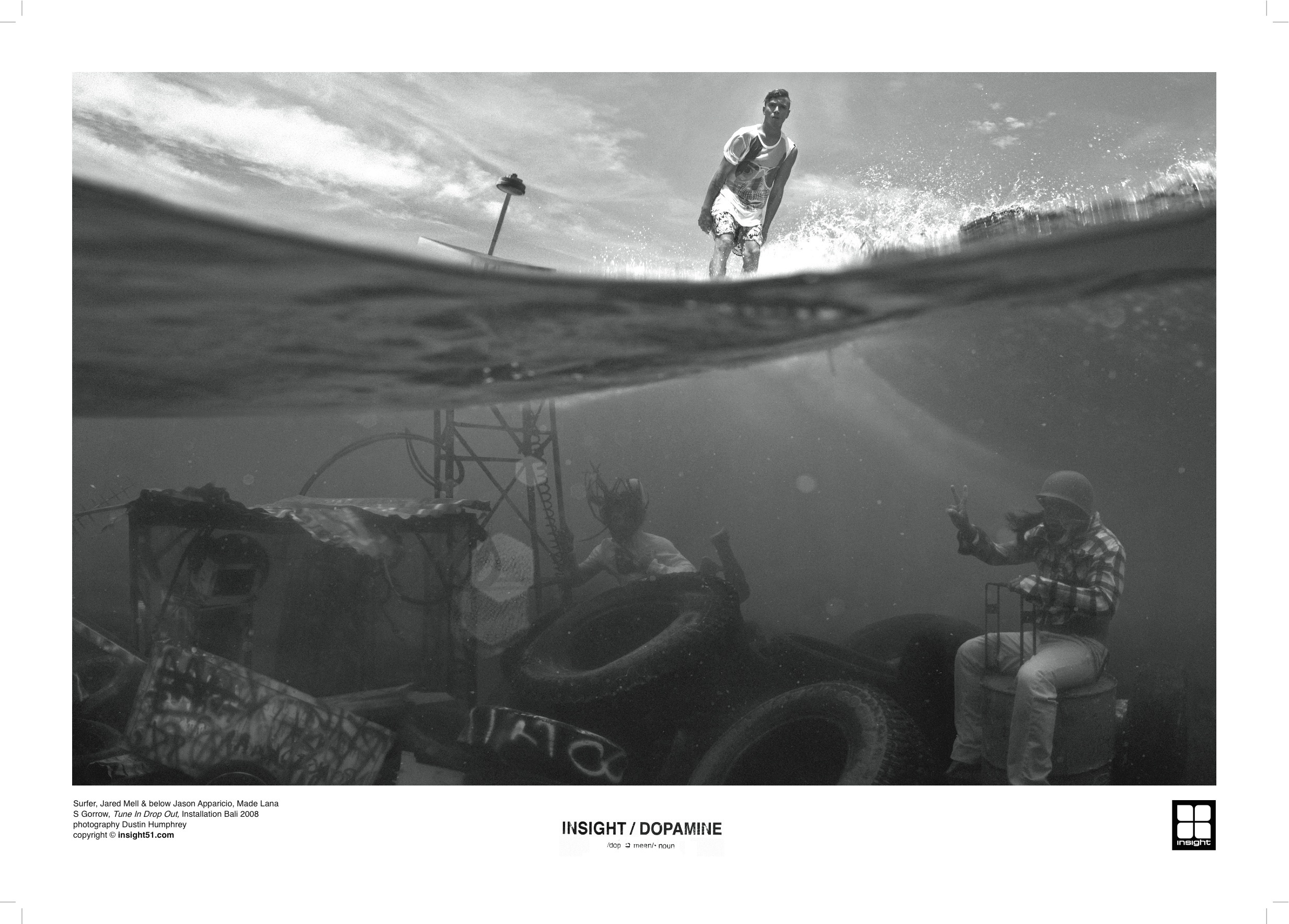 Surfer above water, divers below