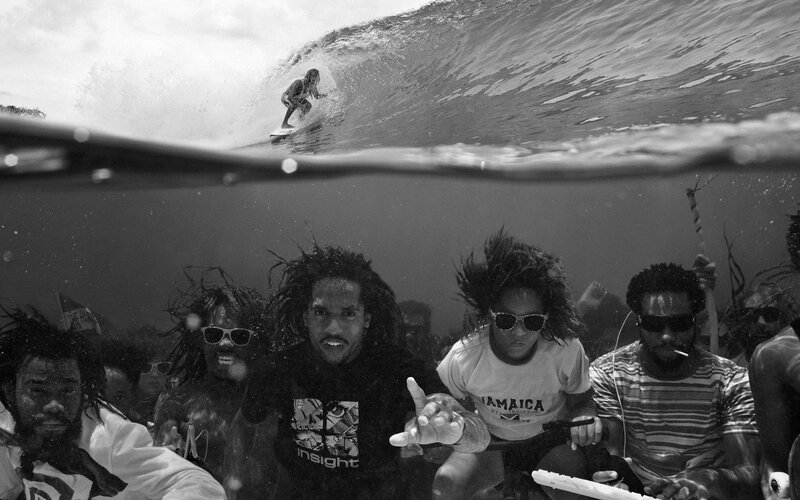 Surfer and underwater crowd
