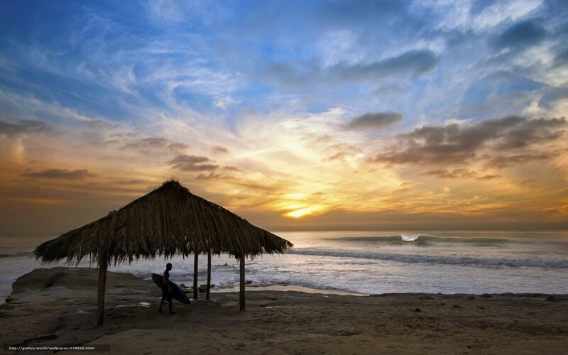Surfer at sunset beach