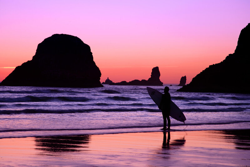 Surfer at sunset on the beach