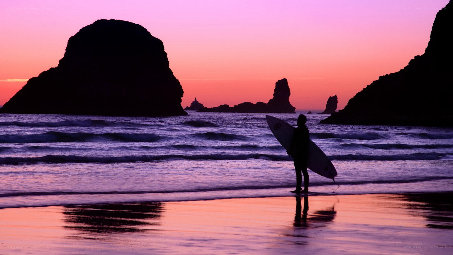 Surfer at sunset on the beach