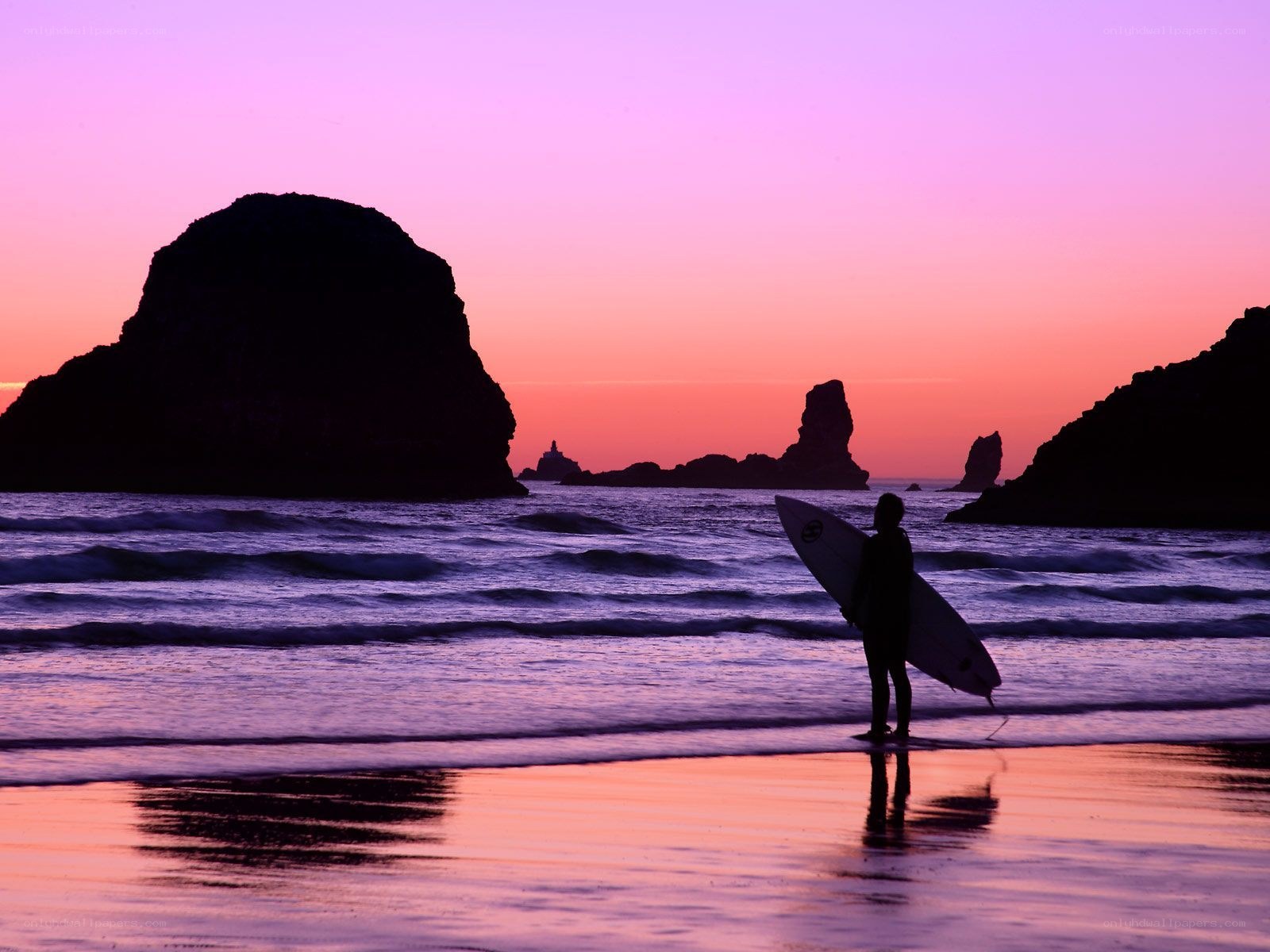 Surfer at sunset on the beach