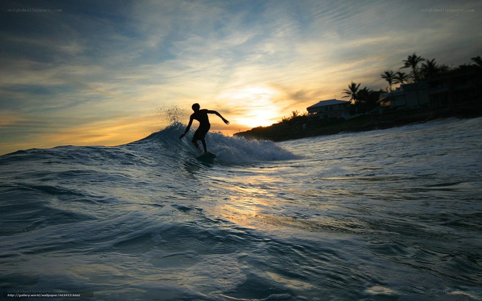 Surfer at sunset silhouette
