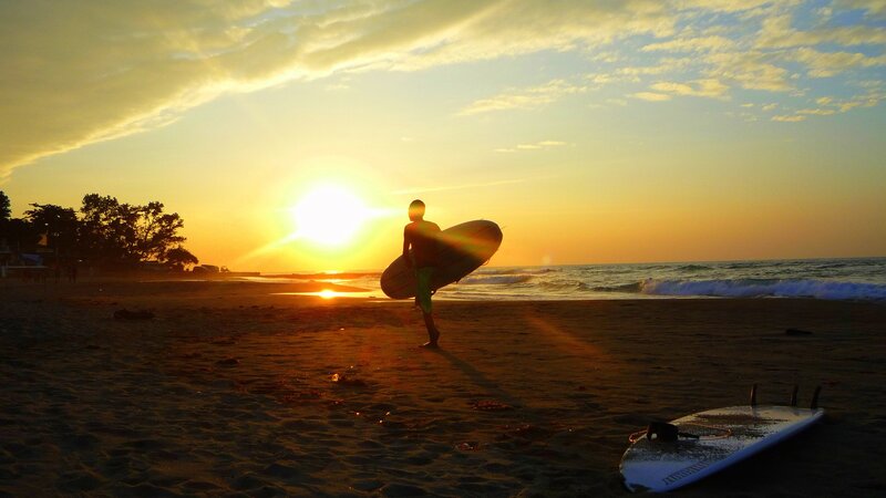 Surfer Carrying Surfboard — Orange, Serene