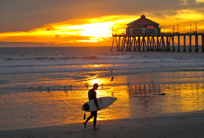 Surfer Carrying Surfboard — Orange