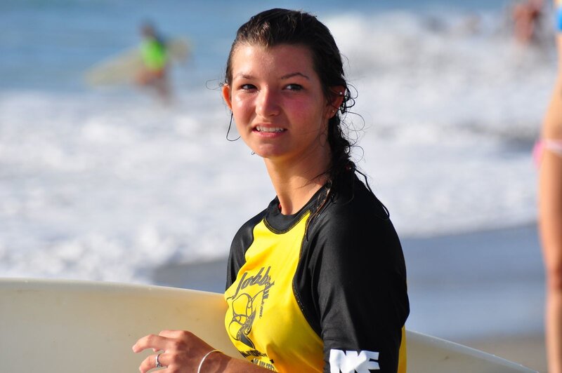 Surfer girl at the beach