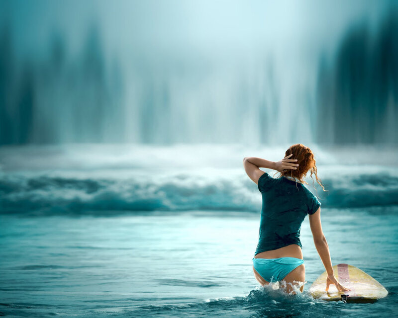 Surfer girl at the shore