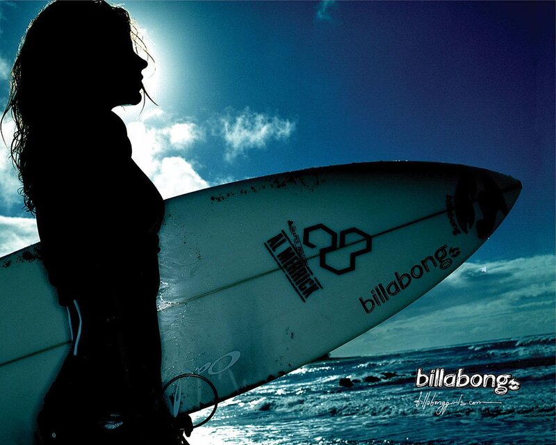 Surfer girl silhouette at beach