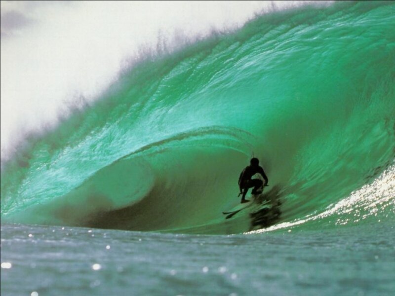 Surfer in a green wave