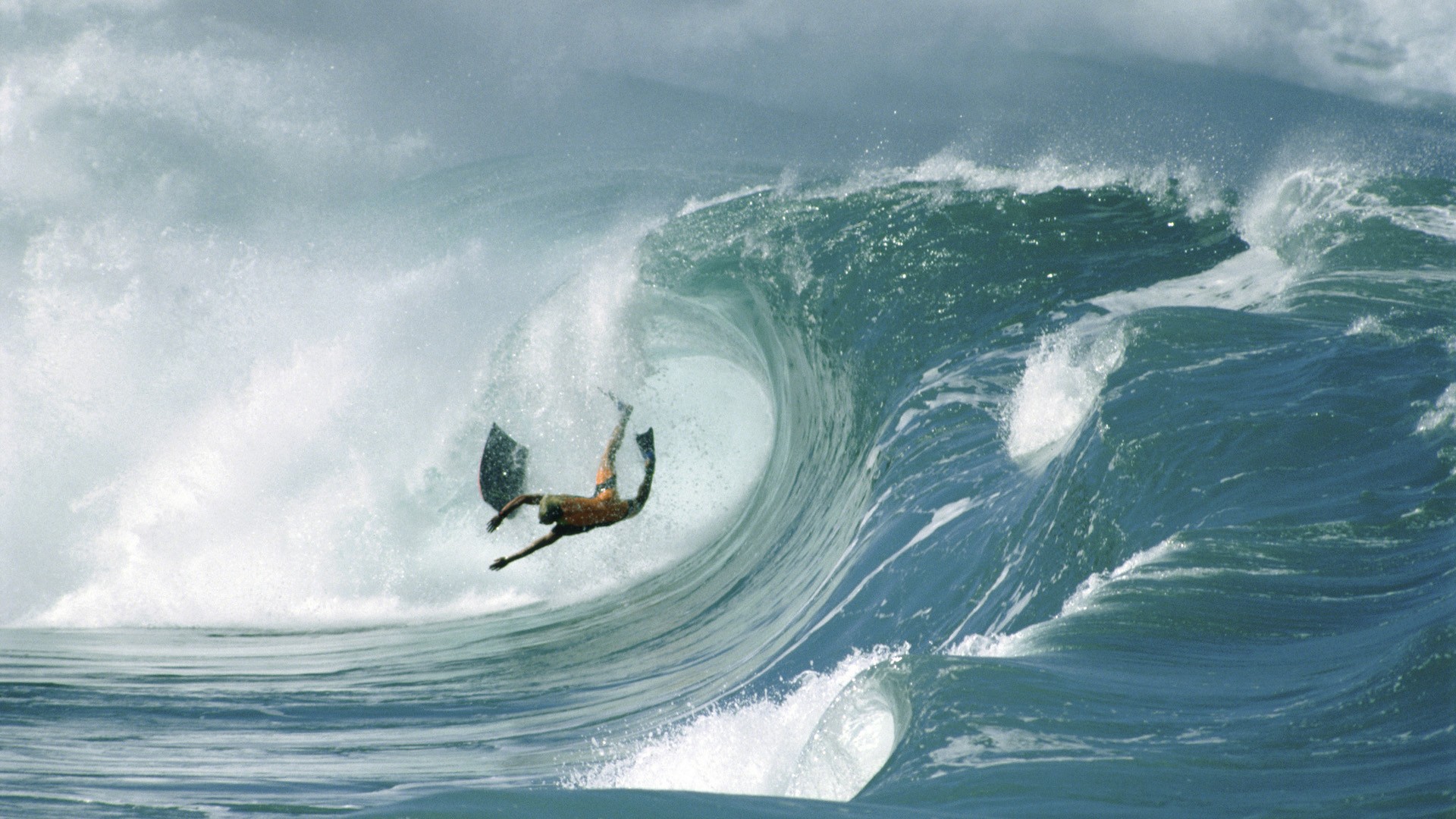 Surfer in a large wave