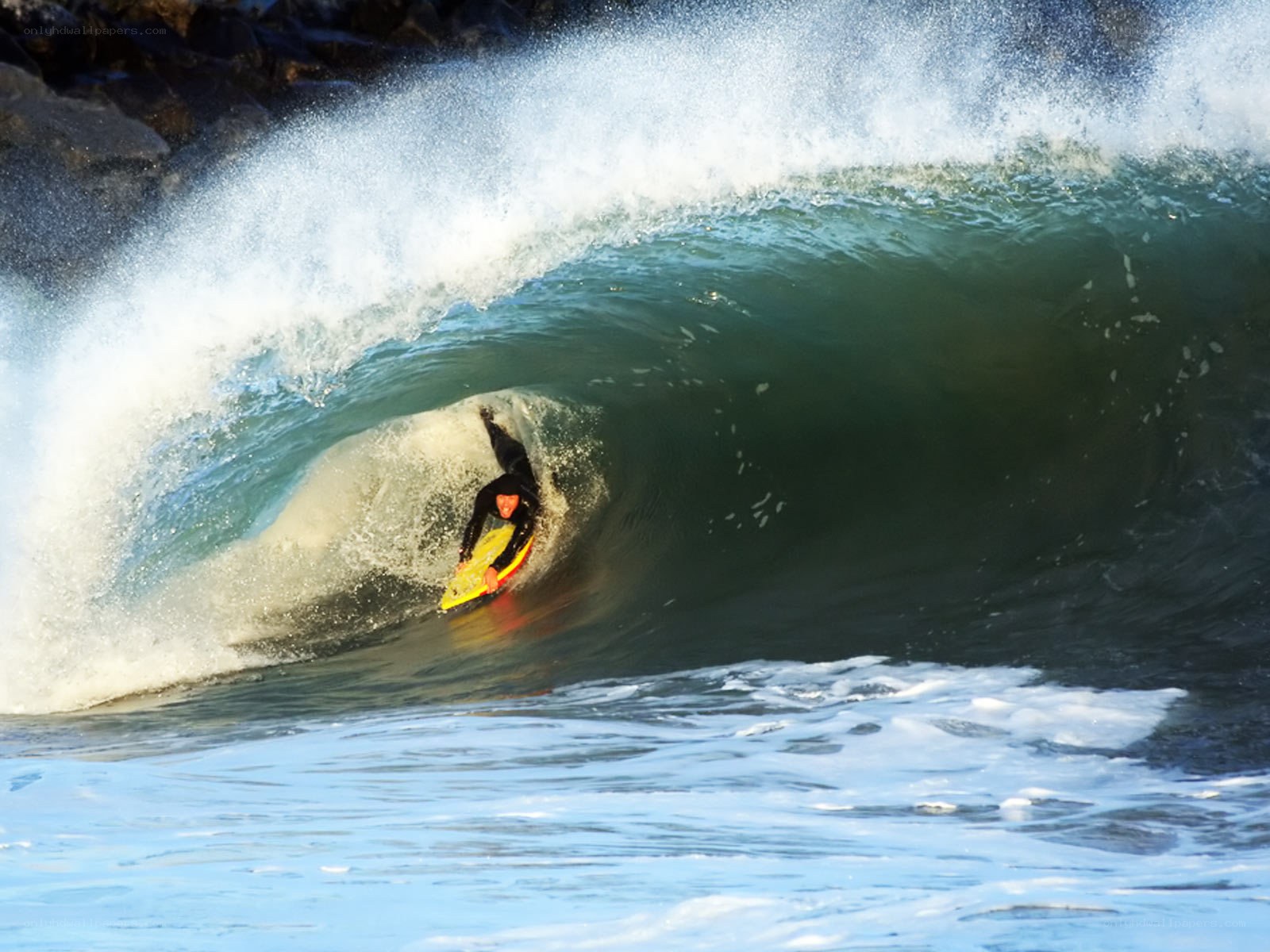 Surfer in a wave barrel
