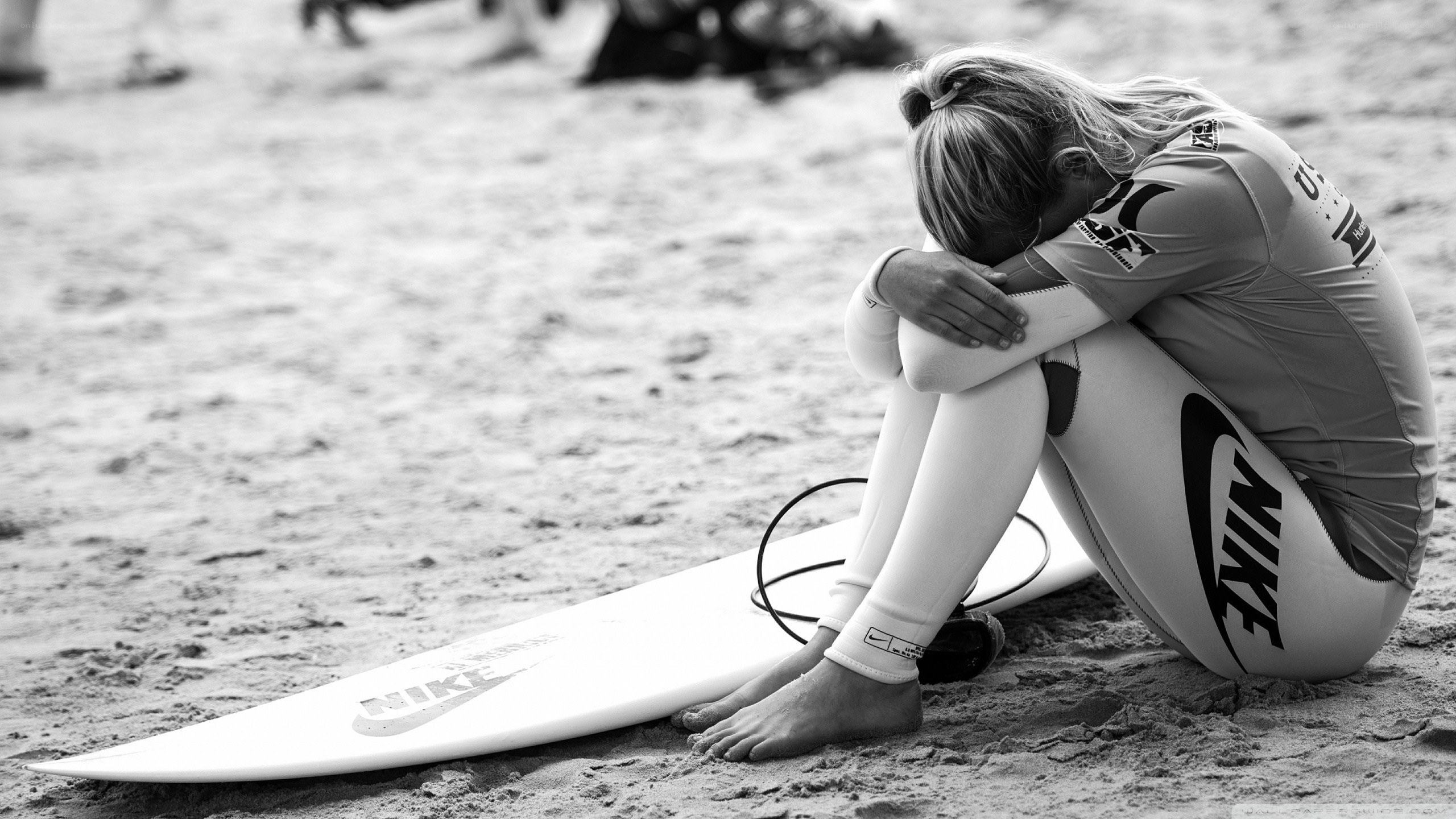 Surfer in distress on beach
