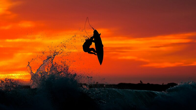 Surfer in Mid-air — Orange, Dramatic