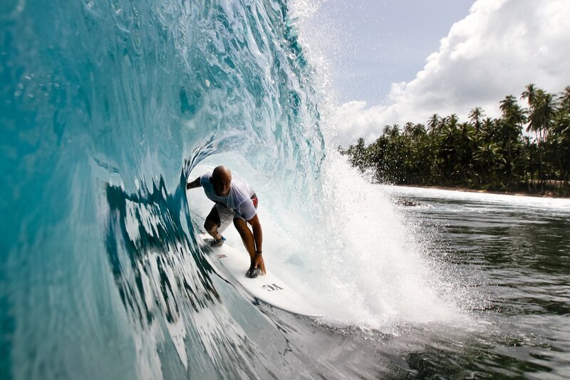 Surfer in Wave Tunnel — Blue, Dynamic, Afternoon, Photograph, Ocean, Palm Trees