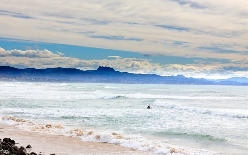 Surfer on a cloudy day